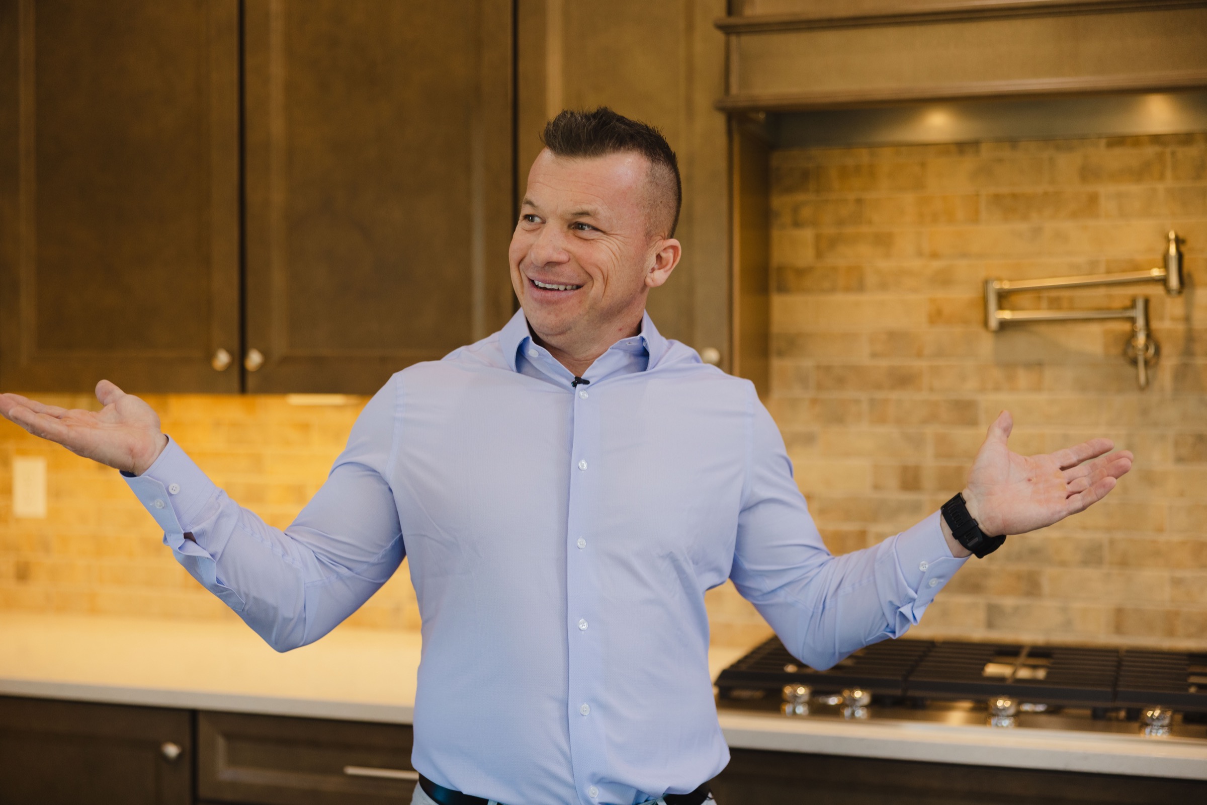 Jason Lewis speaking inside a premium kitchen